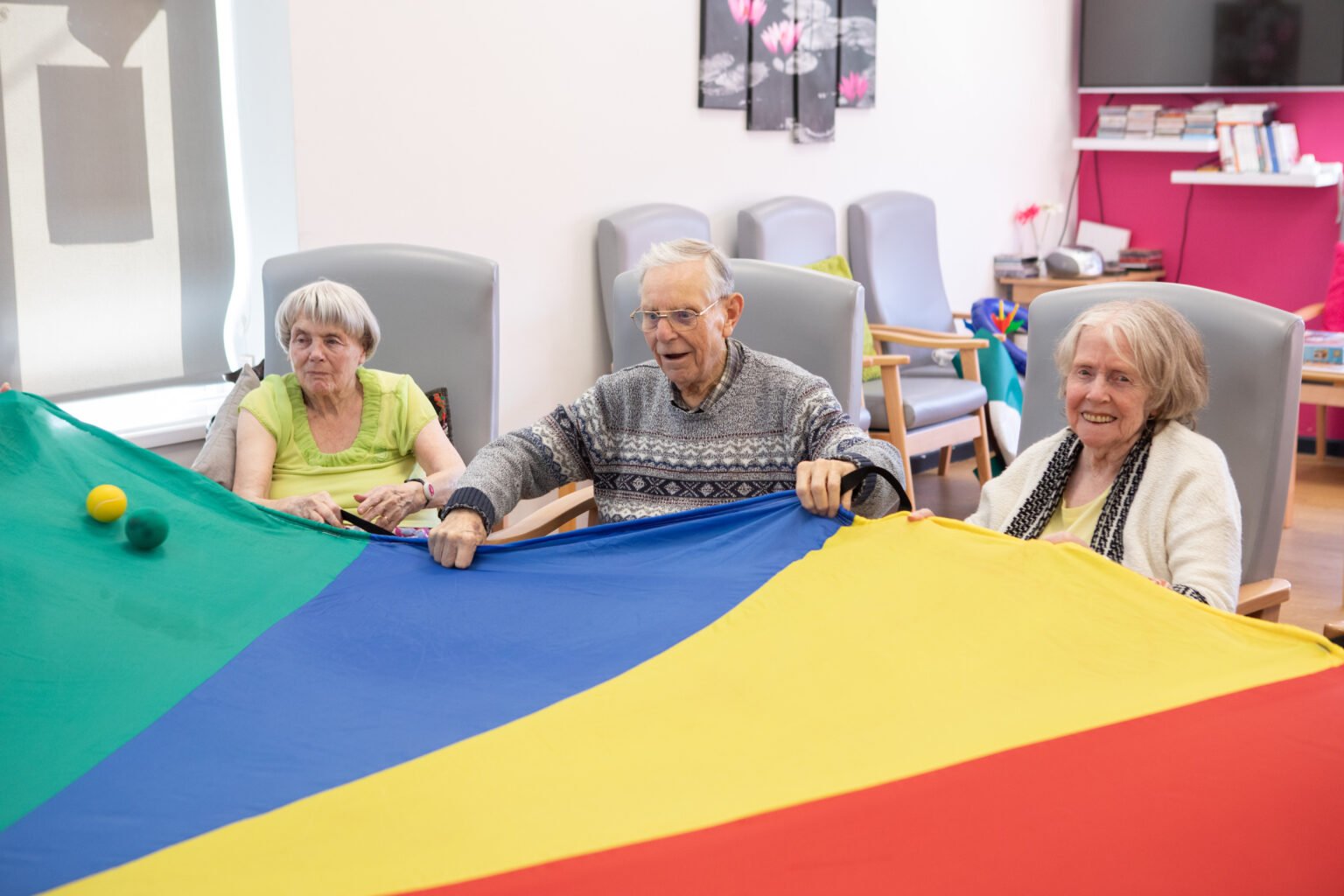 elderly people playing the parachute game