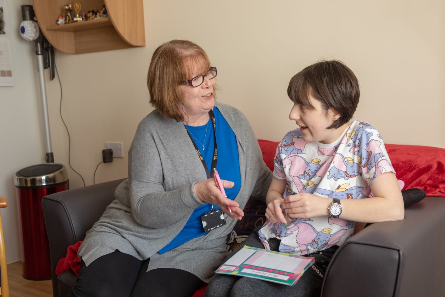 An older woman giving advice to a young woman